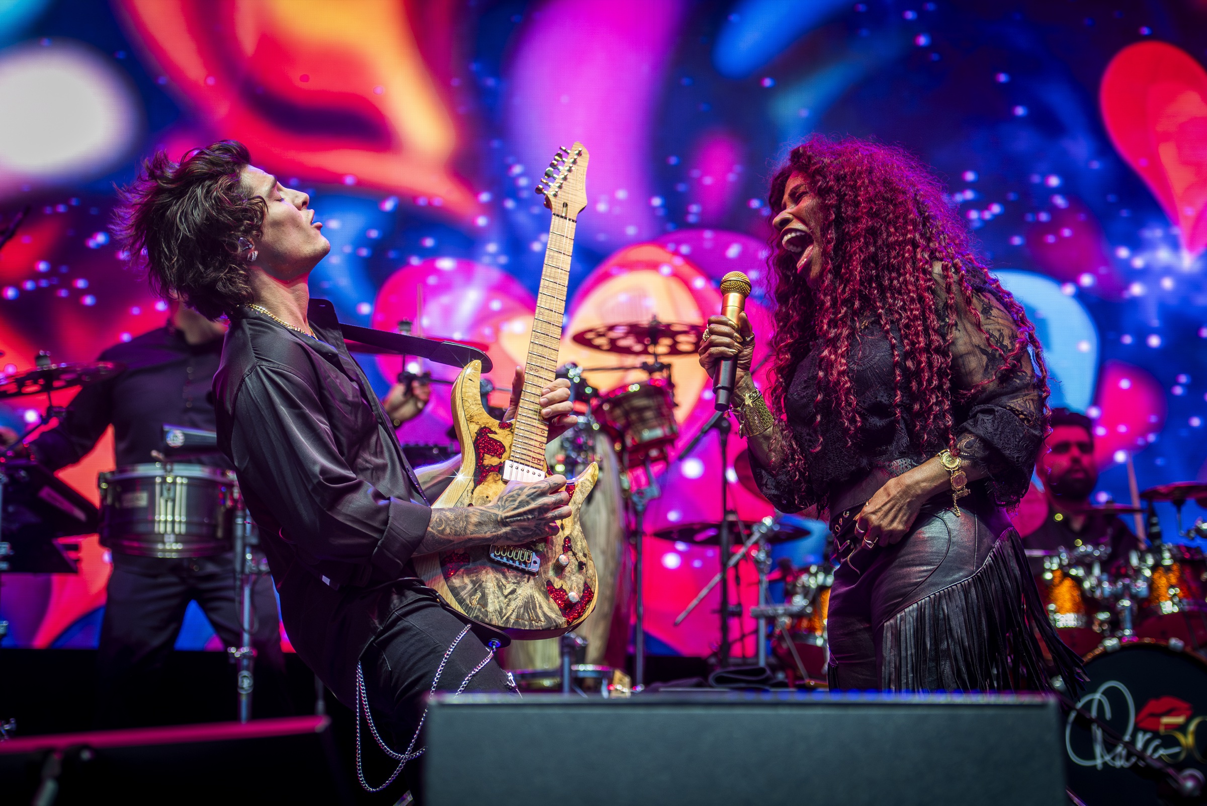 Jon Dretto performing guitar with Chaka Khan at Rosendal Garden Party in Stockholm, Sweden