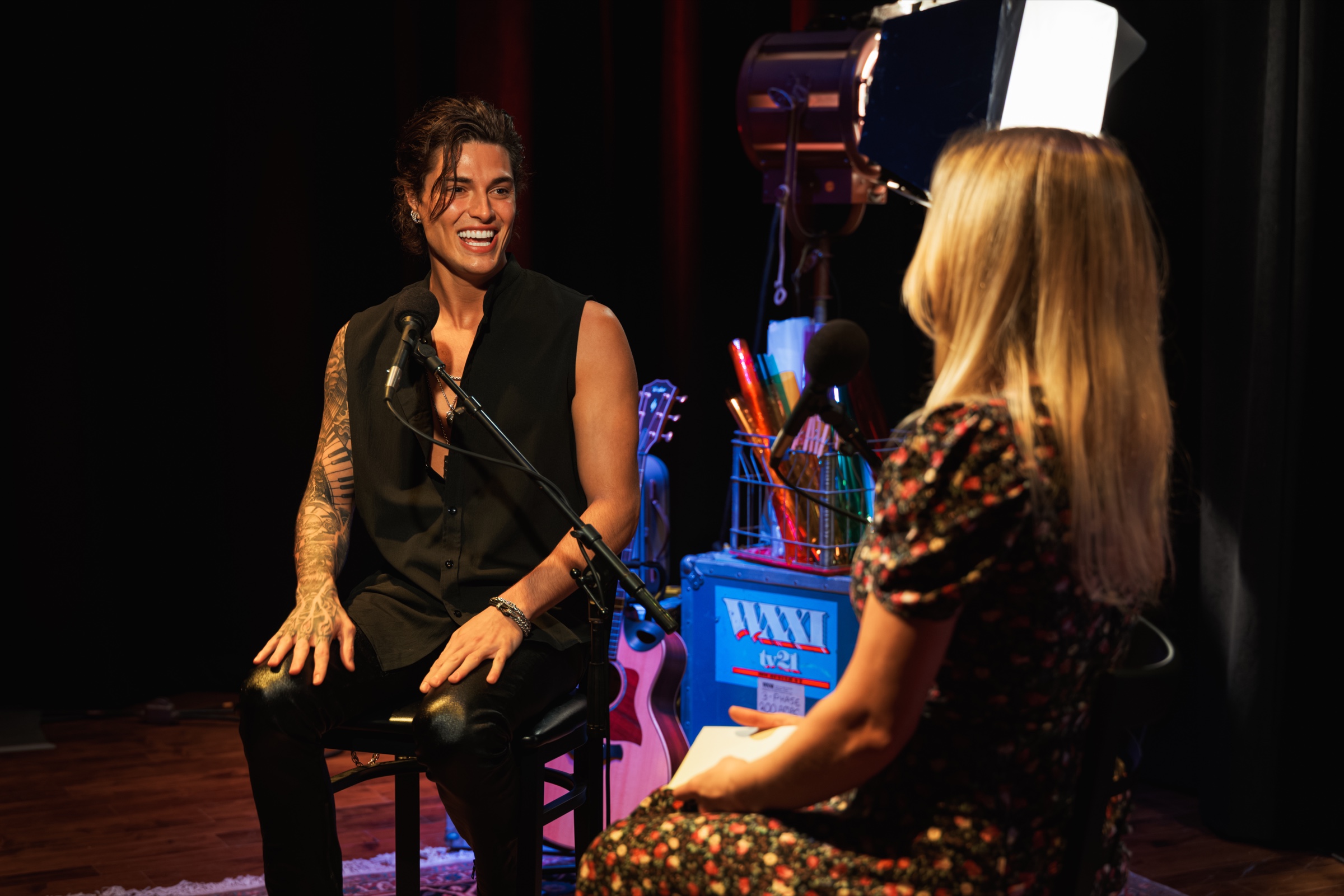 Jon Dretto smiling during his WXXI interview with host Hannah Maier